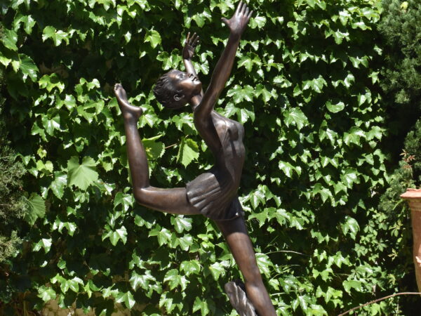 A bronze statue of a ballerina,