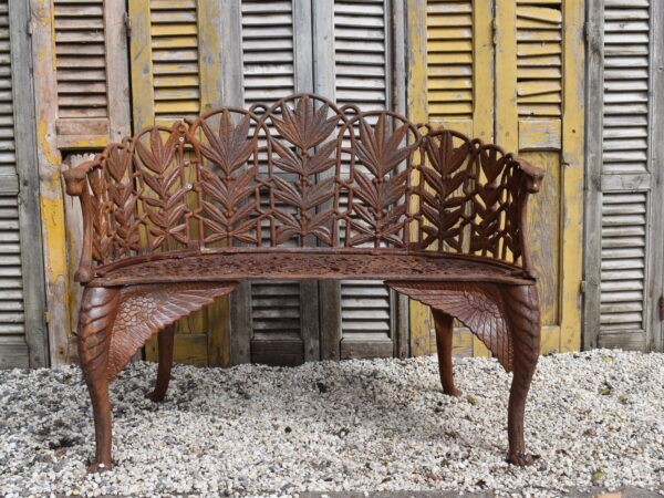 a rust painted Coalbrookdale style cast iron Fern pattern bench