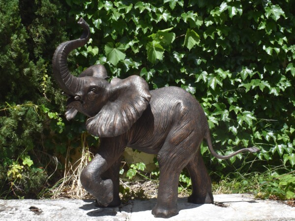 A bronze sculpture of an elephant