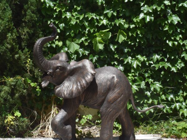 A bronze sculpture of an elephant
