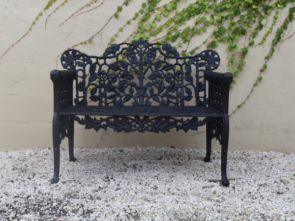 A cast iron Coalbrookdale style Oak and Ivy pattern bench,
