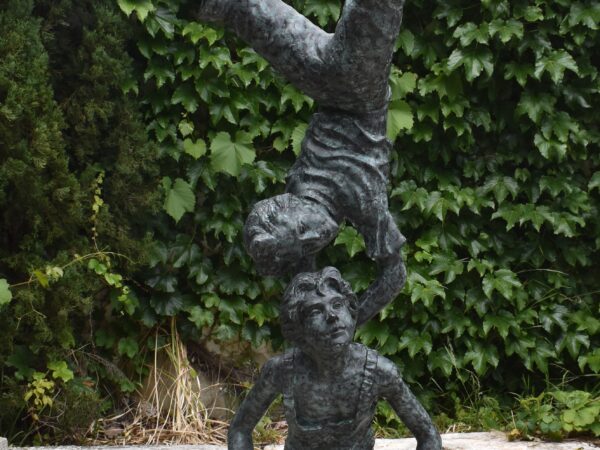 A wonderful bronze statue of a pair of acrobats,