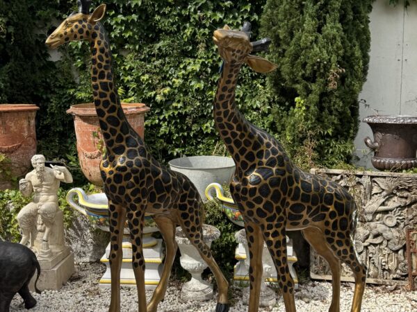 A wonderful pair of large bronze giraffes