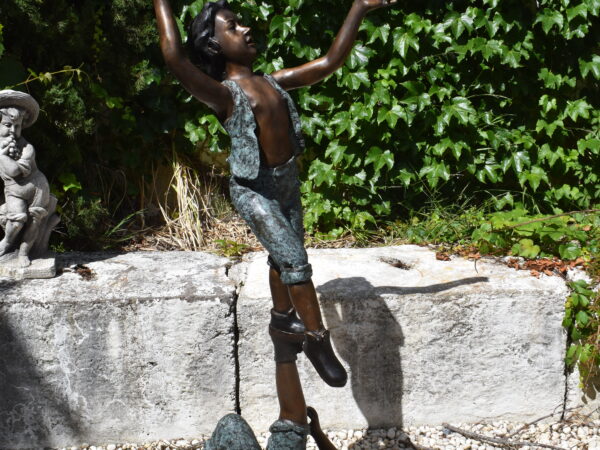 A lovely bronze statue of two acrobatic children