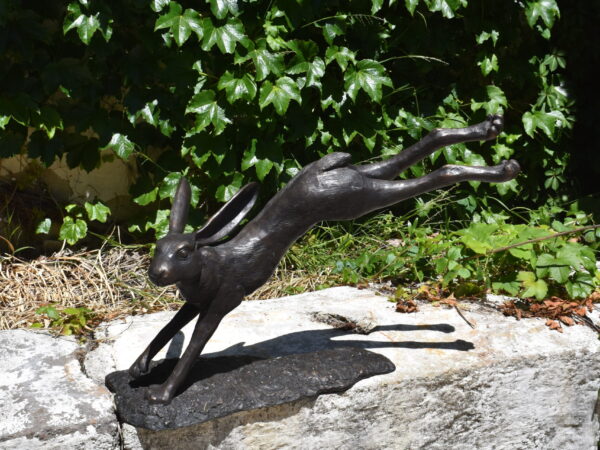 a single bronze running hare.