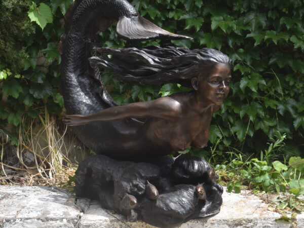 a large bronze mermaid sculpture