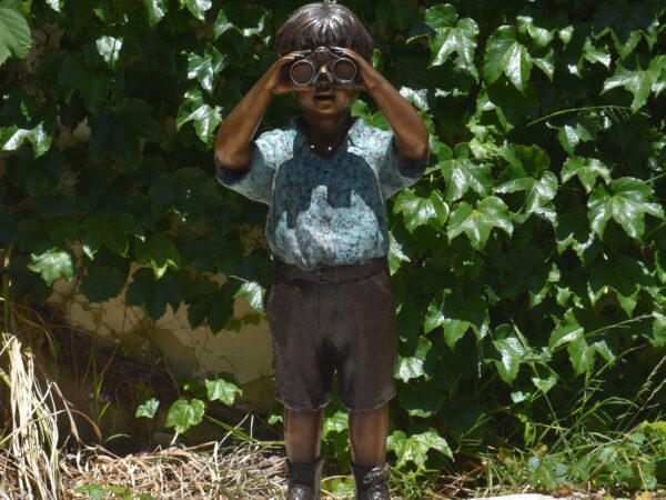 A bronze boy with binoculars