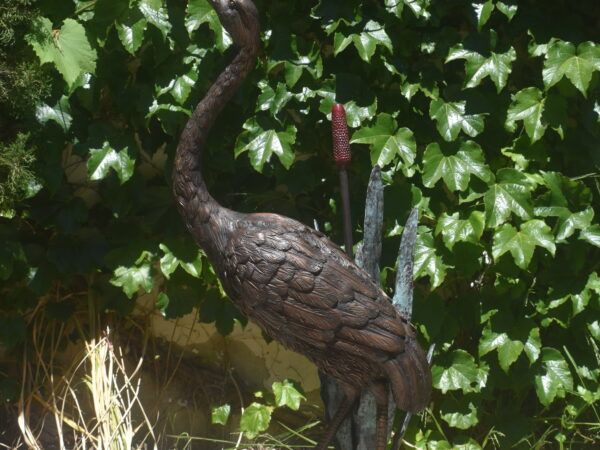 A bronze heron, plumbed as a fountain.