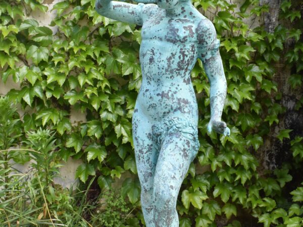 A bronze statue of a musical boy, plumbed as a fountain