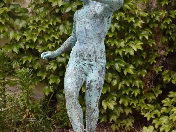 A bronze statue of a young pan, plumbed through the flute.