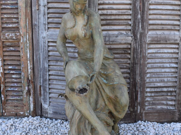 A bronze statue of a Maiden, plumbed as a fountain