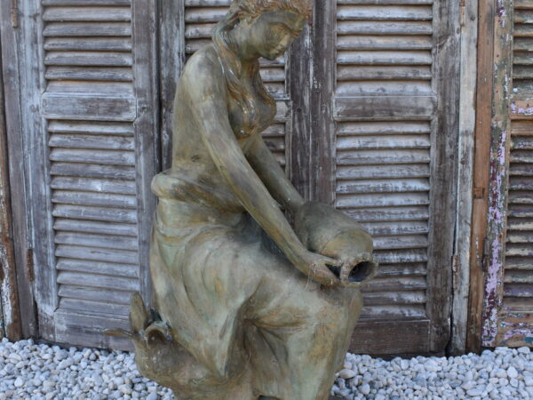 A bronze statue of a Maiden, plumbed as a fountain.