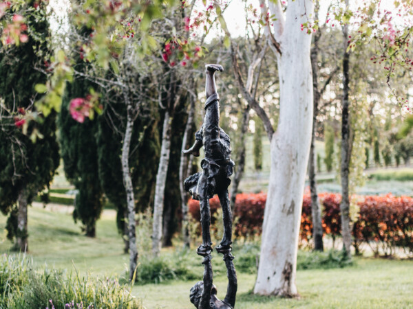 A bronze statue of two acrobatic children