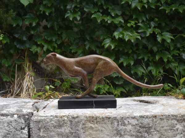 a leaping bronze Cheetah