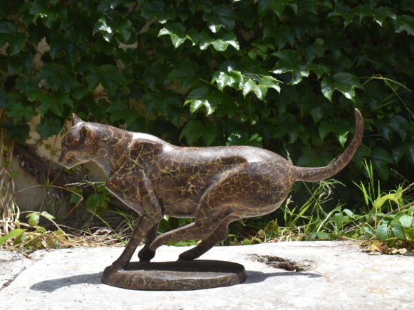A leaping bronze Cheetah