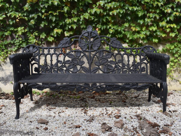 A cast iron Coalbrookdale style Oak and Ivy pattern bench