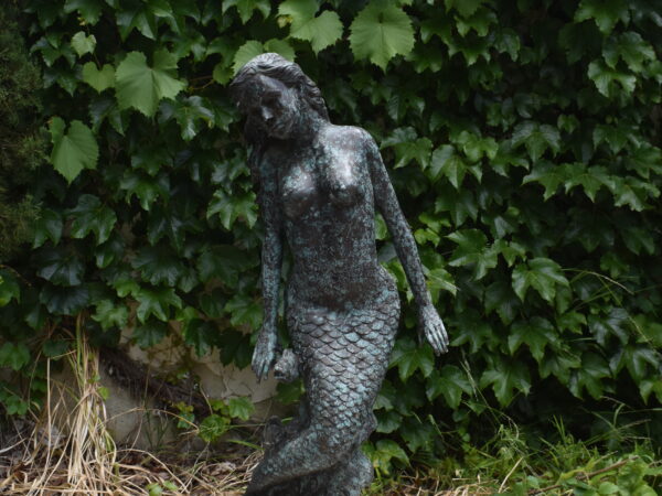 a bronze mermaid plumbed as a fountain