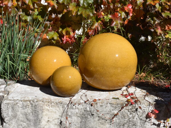 Honey glazed ceramic spheres with flat bottom