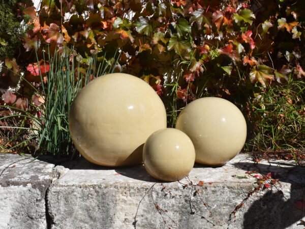 Cream glazed ceramic spheres with flat bottom